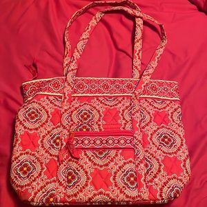 Vera Bradley 2 strap top zipper tote with 6 interior pockets. New condition